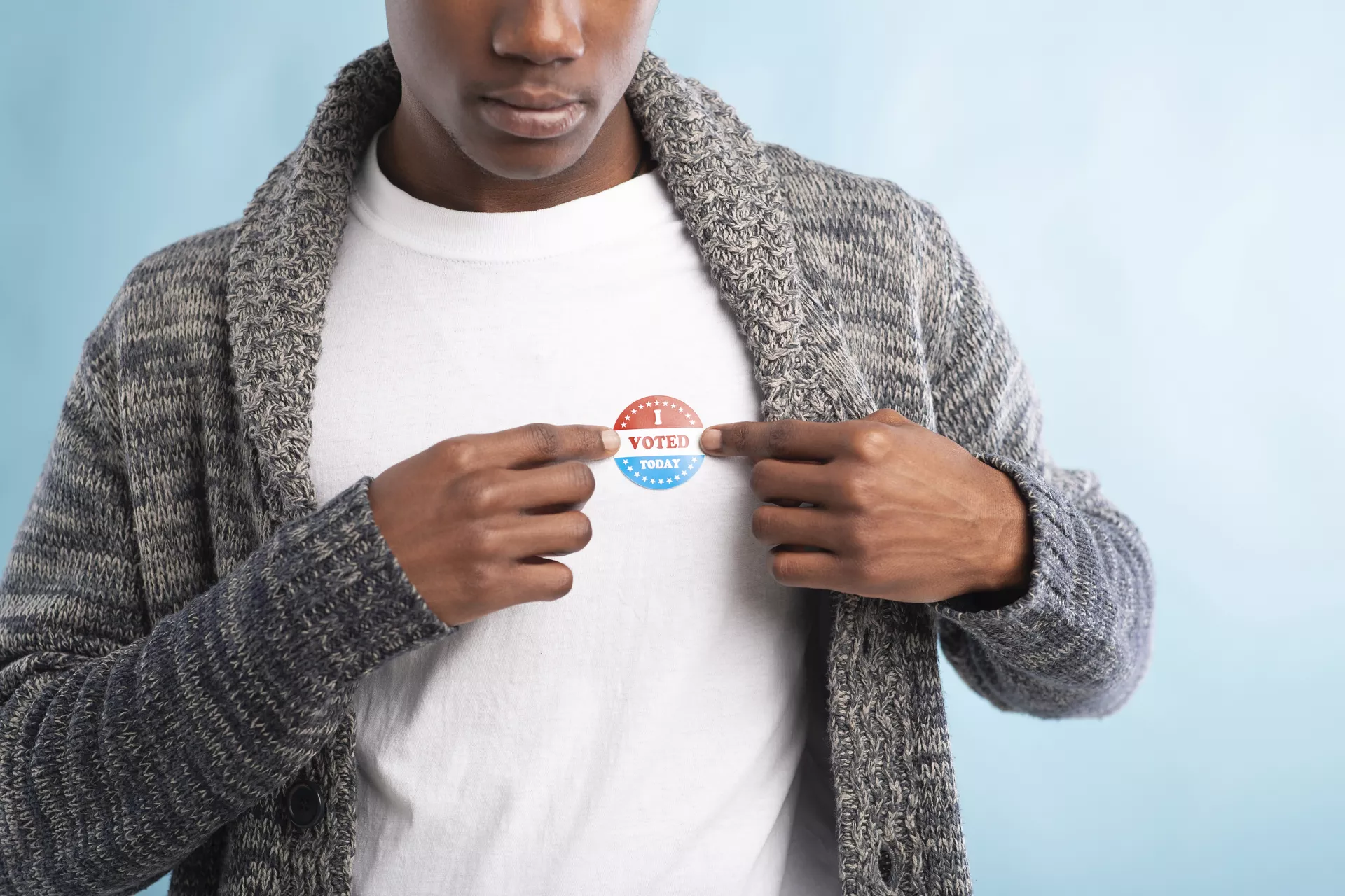 Person with an 'I Voted' sticker