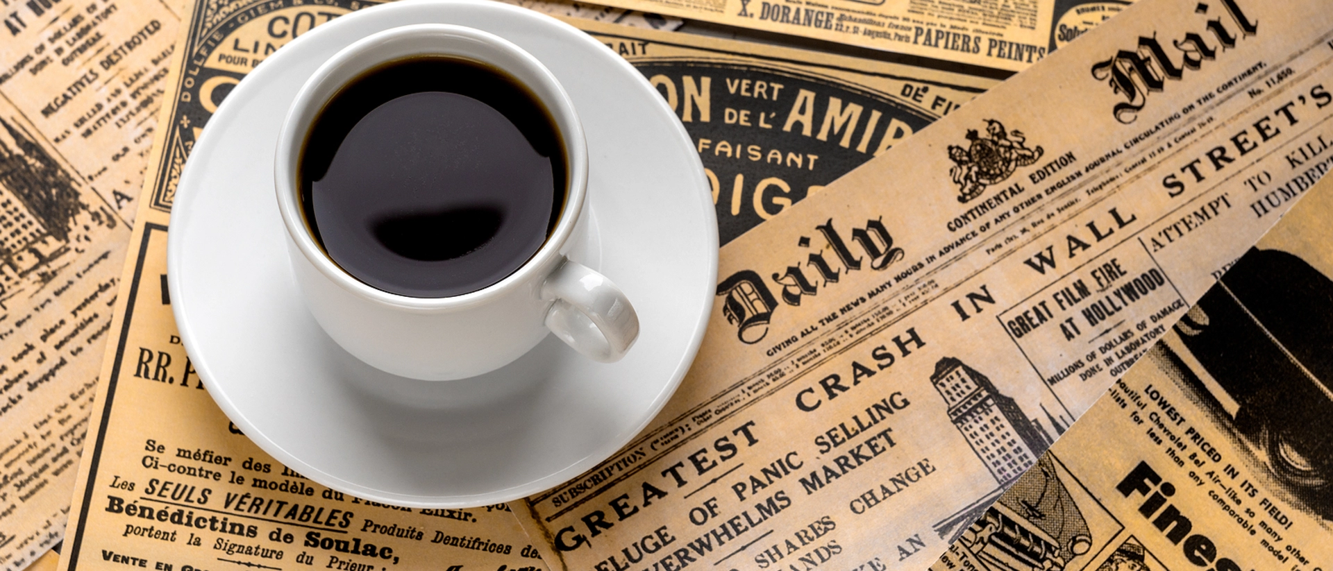 Cup of coffee on top of Daily Mail newspaper
