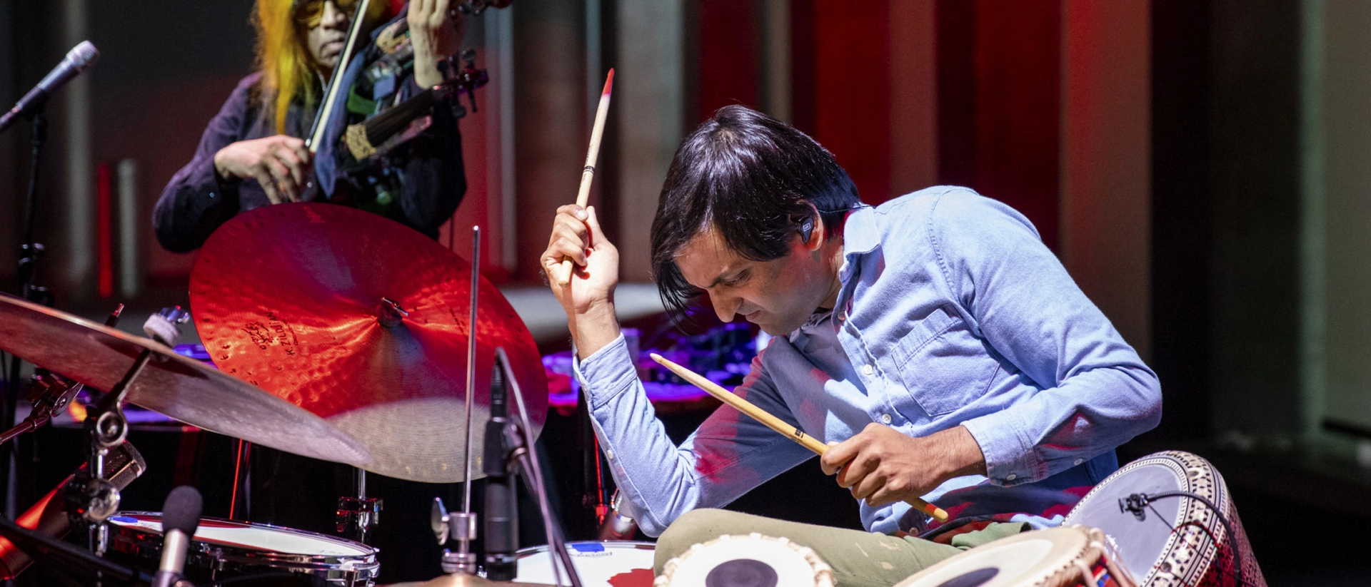 Neel Agrawal playing drums and the tabla