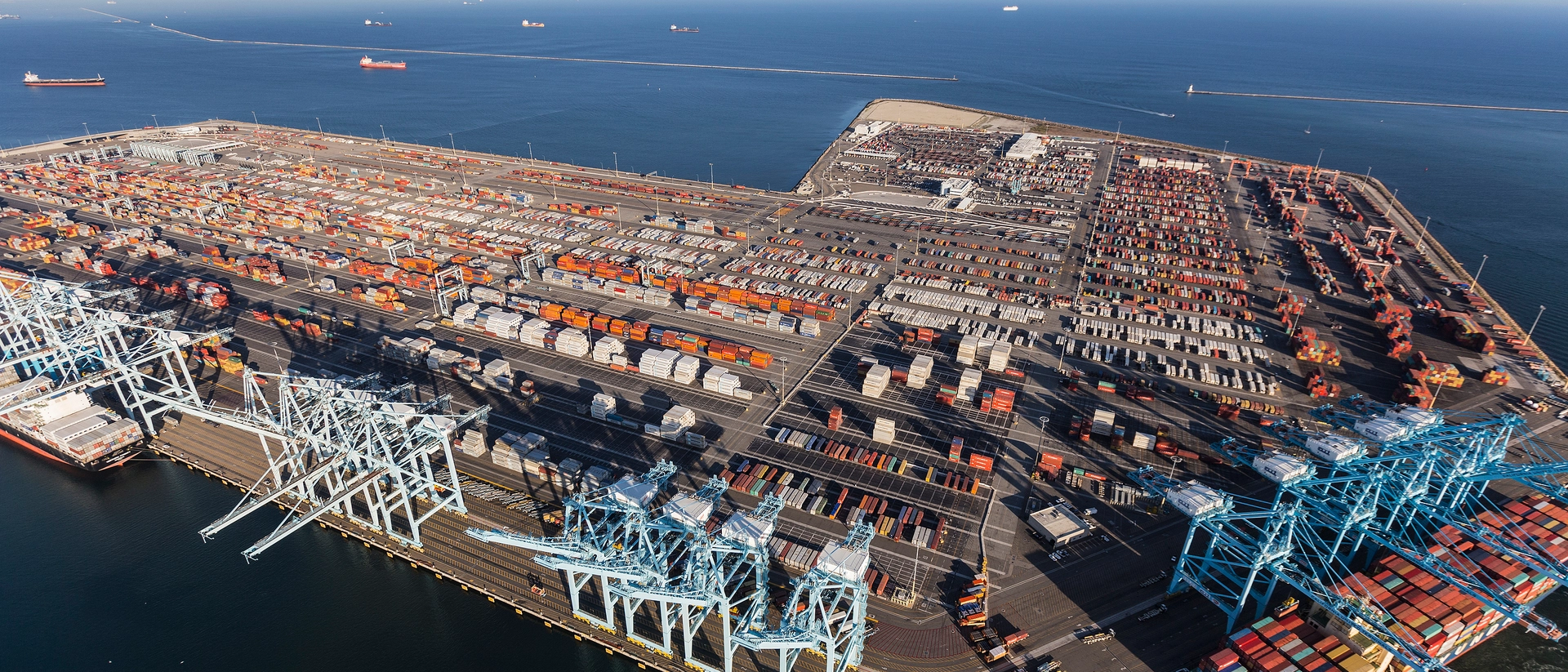 aerial-view-of-cargo%2C-ships-and-containers-at-busy-los-angeles-harbor-pier-400