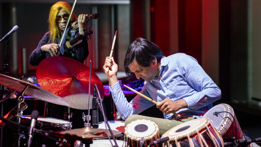 Neel Agrawal playing drums and the tabla